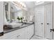 Bright bathroom features double vessel sinks, a quartz countertop, and skylights for natural light at 5801 Marleon Drive Marleon Drive, Windermere, FL 34786