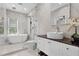 Luxurious bathroom with standalone tub, walk-in shower, and elegant vanity at 5801 Marleon Drive Marleon Drive, Windermere, FL 34786
