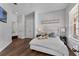 Cozy bedroom with natural light, hardwood floors, and a comfortable bed at 5801 Marleon Drive Marleon Drive, Windermere, FL 34786