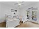 Bright bedroom with two twin beds, balcony access, and a serene beach theme at 5801 Marleon Drive Marleon Drive, Windermere, FL 34786