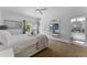 Spacious bedroom with modern media center, large mirror, and ensuite bathroom at 5801 Marleon Drive Marleon Drive, Windermere, FL 34786