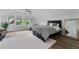Bright bedroom with hardwood floors, windows, and decorative accents at 5801 Marleon Drive Marleon Drive, Windermere, FL 34786