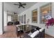 Covered patio showcasing a dining area, ceiling fans, and a stone fireplace for outdoor entertaining at 5801 Marleon Drive Marleon Drive, Windermere, FL 34786