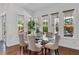 Elegant dining room with natural light, a glass table, and seating for six at 5801 Marleon Drive Marleon Drive, Windermere, FL 34786