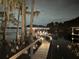 Picturesque dock with a gazebo, seating area, and mature trees at night at 5801 Marleon Drive Marleon Drive, Windermere, FL 34786