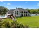 Backyard of a luxury home with a pool, sport court and deck overlooking landscaped lawns at 5801 Marleon Drive Marleon Drive, Windermere, FL 34786
