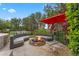 Outdoor fire pit with comfortable seating area for enjoying evenings under the stars near the volleyball court at 5801 Marleon Drive Marleon Drive, Windermere, FL 34786