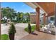 Charming covered porch area with brick accents and outdoor seating at 5801 Marleon Drive Marleon Drive, Windermere, FL 34786