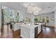 Kitchen with island featuring stainless steel appliances, and views to the living room and backyard at 5801 Marleon Drive Marleon Drive, Windermere, FL 34786