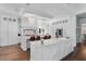 Spacious white kitchen with a large island, stainless steel appliances, and modern lighting fixtures at 5801 Marleon Drive Marleon Drive, Windermere, FL 34786