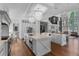 Gourmet kitchen with white cabinetry, quartz countertops, and stainless steel appliances at 5801 Marleon Drive Marleon Drive, Windermere, FL 34786