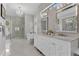 Elegant main bathroom with a glass shower, dual sinks, and luxurious marble finishes at 5801 Marleon Drive Marleon Drive, Windermere, FL 34786