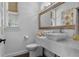Stylish powder room with square vessel sink, marble countertop, and elegant mirror at 5801 Marleon Drive Marleon Drive, Windermere, FL 34786