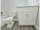 Bathroom with updated vanity, toilet, and tile flooring at 5980 Westgate Dr Dr # 202, Orlando, FL 32835