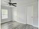 Bedroom with ample natural light, two closets, and a ceiling fan at 5980 Westgate Dr Dr # 202, Orlando, FL 32835