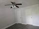 This bedroom features wood-look flooring, two closets, and a ceiling fan with lighting at 5980 Westgate Dr Dr # 202, Orlando, FL 32835