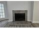 Modern fireplace with gray tile surround and hearth enhances the living space at 5980 Westgate Dr Dr # 202, Orlando, FL 32835