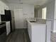 Kitchen with white cabinets, stainless steel appliances, and a stainless steel sink at 5980 Westgate Dr Dr # 202, Orlando, FL 32835