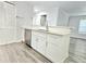 Remodeled kitchen features stainless appliances and white cabinets at 5980 Westgate Dr Dr # 202, Orlando, FL 32835