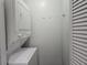 Convenient laundry area with stacked washer and dryer and storage at 5980 Westgate Dr Dr # 202, Orlando, FL 32835