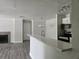 Open-concept living area with fireplace, kitchen island and updated kitchen appliances at 5980 Westgate Dr Dr # 202, Orlando, FL 32835