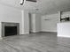 Living room with gray floors, fireplace, kitchen view at 5980 Westgate Dr Dr # 202, Orlando, FL 32835