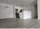 Open-concept living space with gray flooring, updated kitchen at 5980 Westgate Dr Dr # 202, Orlando, FL 32835