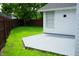 An open concrete patio, fenced-in yard, and white vinyl siding combine for an inviting backyard space at 6500 Abercrombie Ct, Orlando, FL 32835