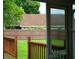View of the backyard and fenced perimeter, seen from the screened-in back porch, offering a private outdoor space at 6500 Abercrombie Ct, Orlando, FL 32835
