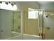 Bathroom featuring shower area with glass enclosure and tiled walls and shower fixture at 6500 Abercrombie Ct, Orlando, FL 32835
