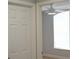 View into a bedroom with a ceiling fan and a window with a view of the outside at 6500 Abercrombie Ct, Orlando, FL 32835