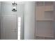 Bright entryway with a decorative light fixture, white door with glass panes, and built-in shelving at 6500 Abercrombie Ct, Orlando, FL 32835