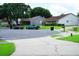 Well-maintained street with manicured lawns, sidewalks, and parked cars at 6500 Abercrombie Ct, Orlando, FL 32835