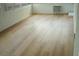 Open sunroom featuring wood-look vinyl flooring, windows, and air conditioning at 6500 Abercrombie Ct, Orlando, FL 32835