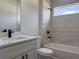 Modern bathroom with white vanity, quartz countertop, and tiled shower/tub combo at 6516 Sw 149 Th Lane Rd, Ocala, FL 34473