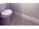 Close-up of a toilet showing the tile floor at 6516 Sw 149 Th Lane Rd, Ocala, FL 34473