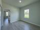 Cozy bedroom with window offering natural light and neutral color palette at 6516 Sw 149 Th Lane Rd, Ocala, FL 34473