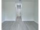 Hallway with gray wood-like flooring at 6516 Sw 149 Th Lane Rd, Ocala, FL 34473