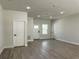 Open living room with recessed lighting and new flooring provides ample space at 6516 Sw 149 Th Lane Rd, Ocala, FL 34473