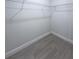 Walk-in closet with wire shelving is spacious and has wood-look flooring at 6516 Sw 149 Th Lane Rd, Ocala, FL 34473