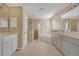 Bright bathroom featuring a walk-in shower, soaking tub, and double sink vanity at 7184 Maleberry Run, Winter Garden, FL 34787