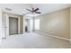 Neutral bedroom with an open walk-in closet, and a window bringing in lots of light at 7184 Maleberry Run, Winter Garden, FL 34787