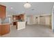 Open-concept kitchen featuring granite countertops, stainless steel appliances, and easy access to the living spaces at 7184 Maleberry Run, Winter Garden, FL 34787