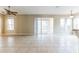 Spacious living room featuring tile floors, neutral walls and sliding glass doors for natural light at 7184 Maleberry Run, Winter Garden, FL 34787