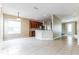 Open living area with tile flooring, ample natural light, and seamless flow to the adjacent kitchen at 7184 Maleberry Run, Winter Garden, FL 34787