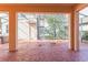 Covered patio featuring stained concrete, ceiling fan, and staircase to the upper level at 7184 Maleberry Run, Winter Garden, FL 34787