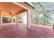 Wide covered patio with stained concrete, ceiling fan, and view of the yard at 7184 Maleberry Run, Winter Garden, FL 34787