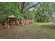 Large backyard featuring a gazebo, seating area, and ample green space at 826 Garden Plz, Orlando, FL 32803