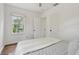Bright bedroom with natural light streaming in through a large window at 826 Garden Plz, Orlando, FL 32803