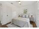 A bright bedroom with hardwood floors and natural light streaming in from a window at 826 Garden Plz, Orlando, FL 32803